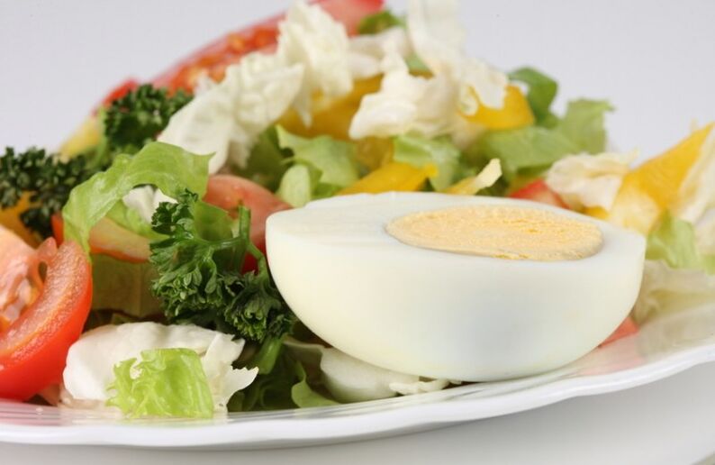 Fresh vegetable salad with boiled egg in Maggie's diet menu