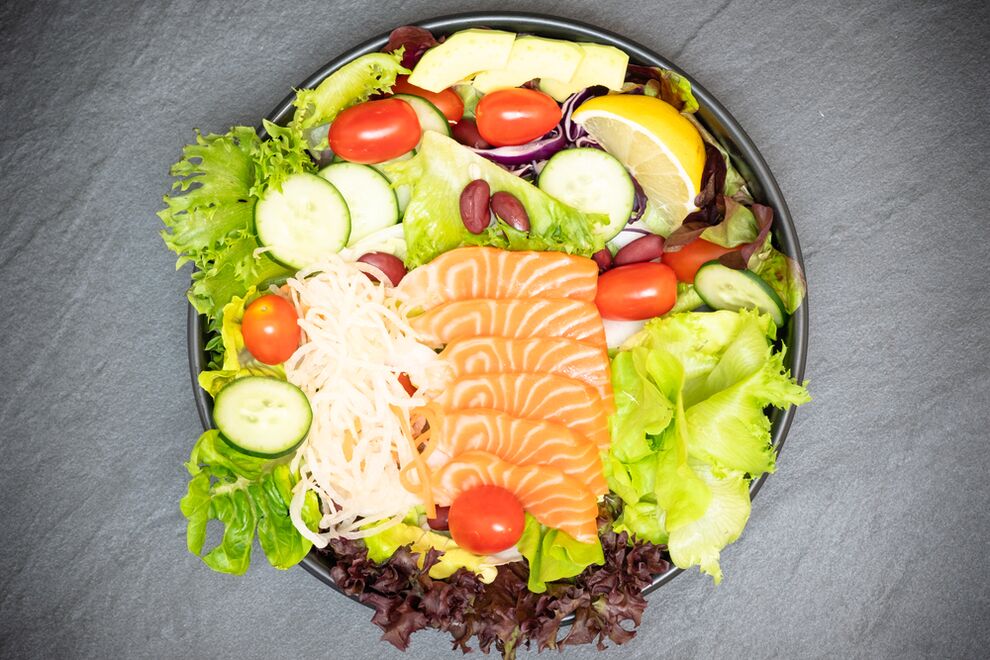 A delicious salad with salmon in the menu of proper nutrition for weight loss