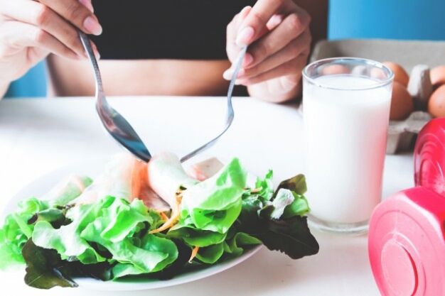 Salad and a glass of yogurt